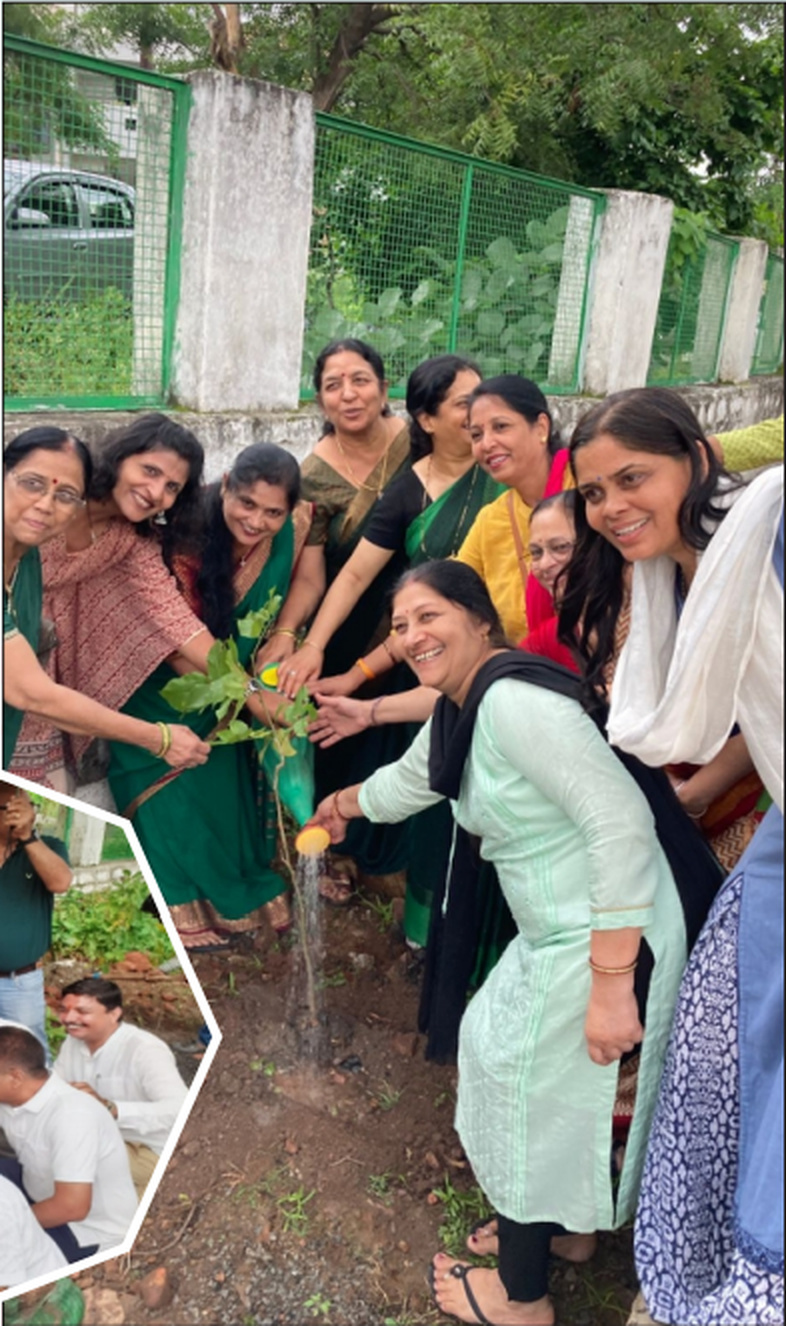Women participating in a tree plantation activity during the Green Bhopal Drive.
