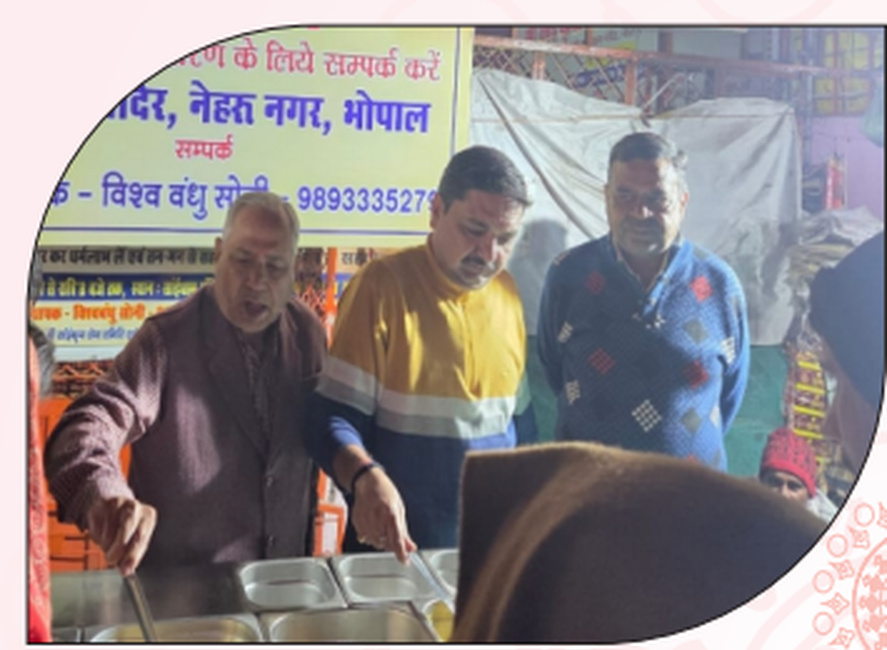 Volunteers serving food during the Food, Clothing & Blanket Distribution Programme.