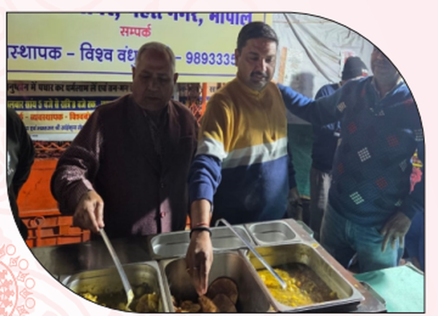 Volunteers preparing food portions during the distribution programme.