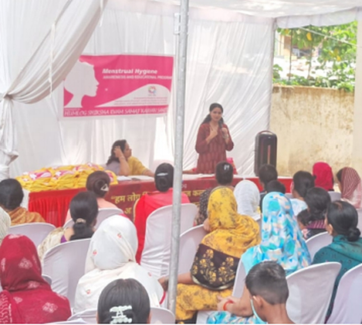 A health awareness speaker addressing women during the menstrual health programme.